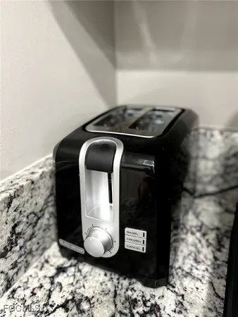 a bedroom with a bed and dresser