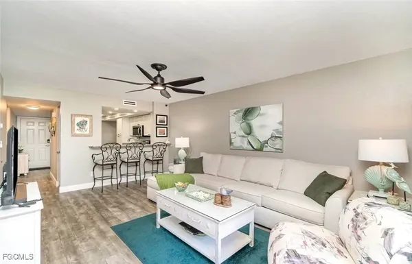 a living room with furniture and a table