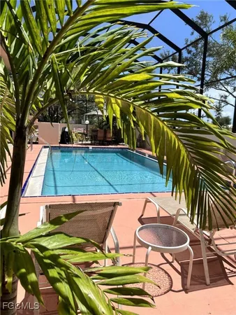 a view of swimming pool with a patio