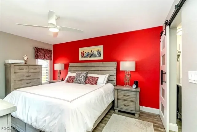 a bedroom with a bed and a dresser