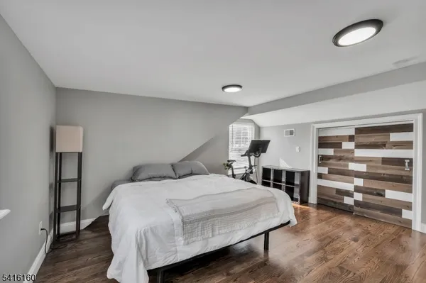a bedroom with a bed and a cabinets