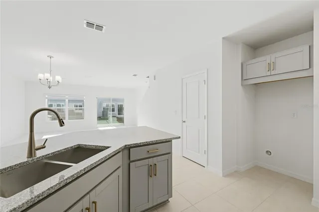 a kitchen with a sink and cabinets