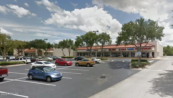 a view of a sign board with a big yard