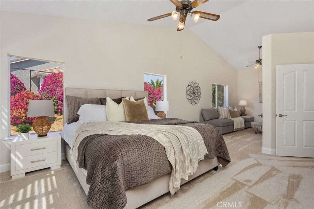 1795 Palomares Road Fallbrook, CA 92028 - Photo 20 of 37 a bedroom with a bed and a chandelier