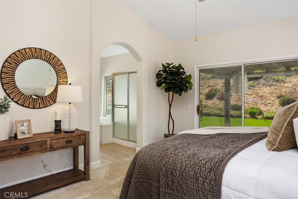 1795 Palomares Road Fallbrook, CA 92028 - Photo 22 of 37 a bedroom with a bed and a large window