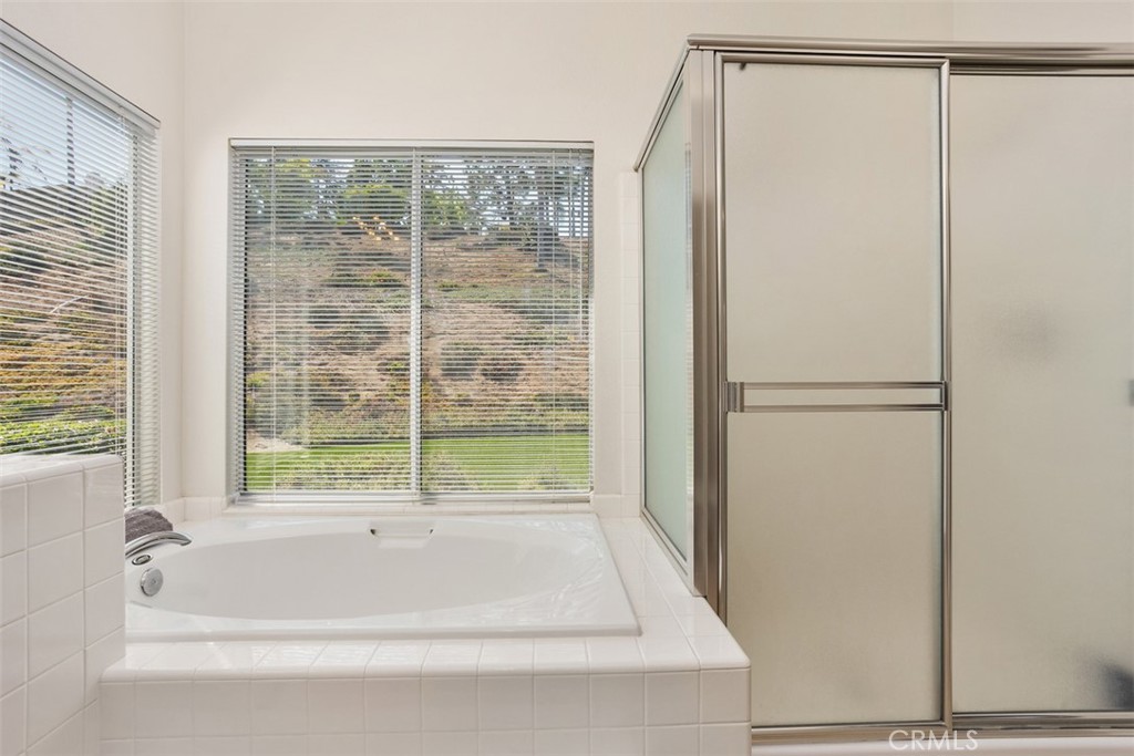 1795 Palomares Road Fallbrook, CA 92028 - Photo 25 of 37 a bathroom with a bathtub and a shower