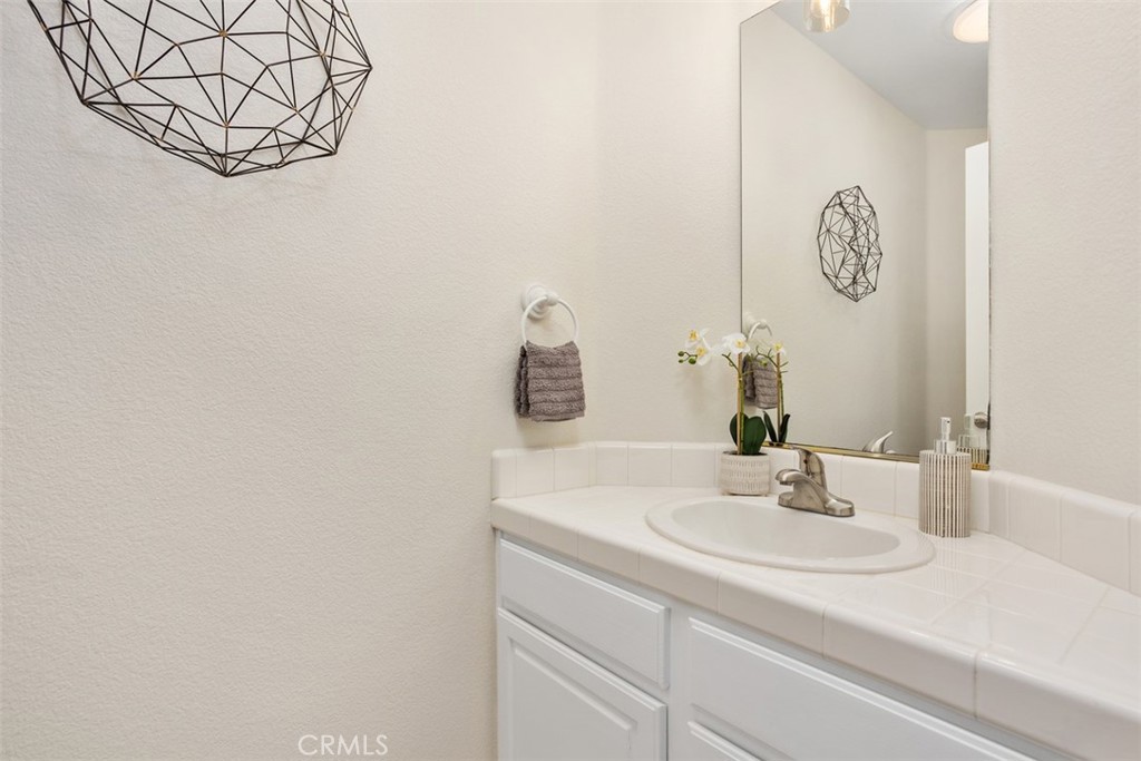 1795 Palomares Road Fallbrook, CA 92028 - Photo 30 of 37 a bathroom with a sink and a mirror