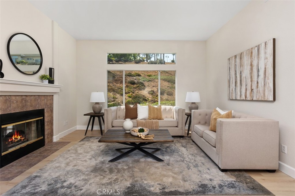 1795 Palomares Road Fallbrook, CA 92028 - Photo 7 of 37 a living room with furniture a fireplace and a large window