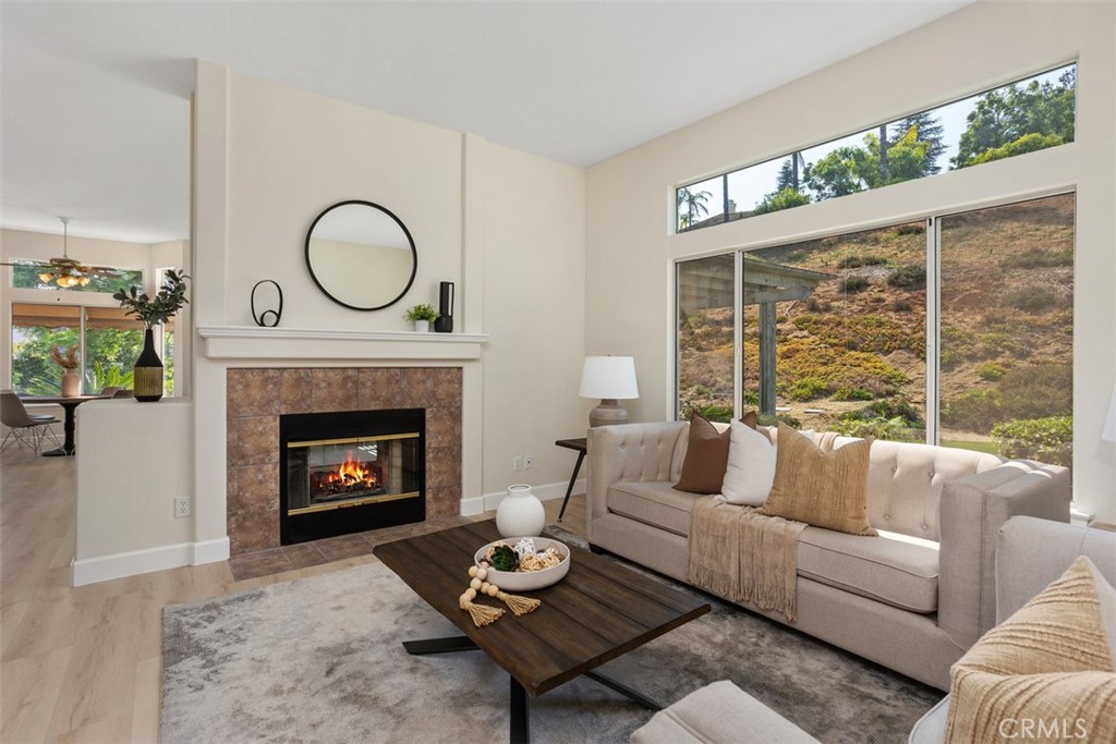 1795 Palomares Road Fallbrook, CA 92028 - Photo 8 of 37 a living room with furniture a fireplace and a large window