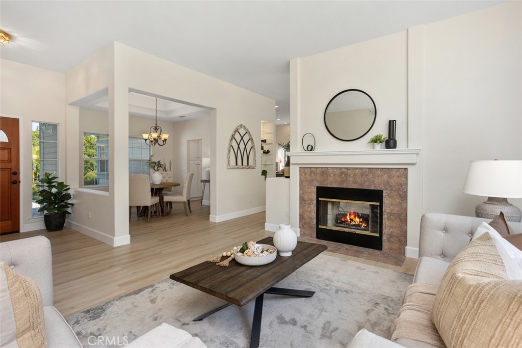 1795 Palomares Road Fallbrook, CA 92028 - Photo 9 of 37 a living room with furniture a rug and a fireplace