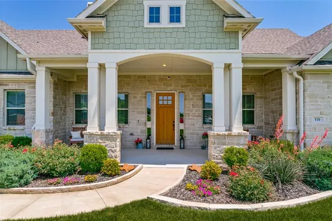 a front view of a house with a porch