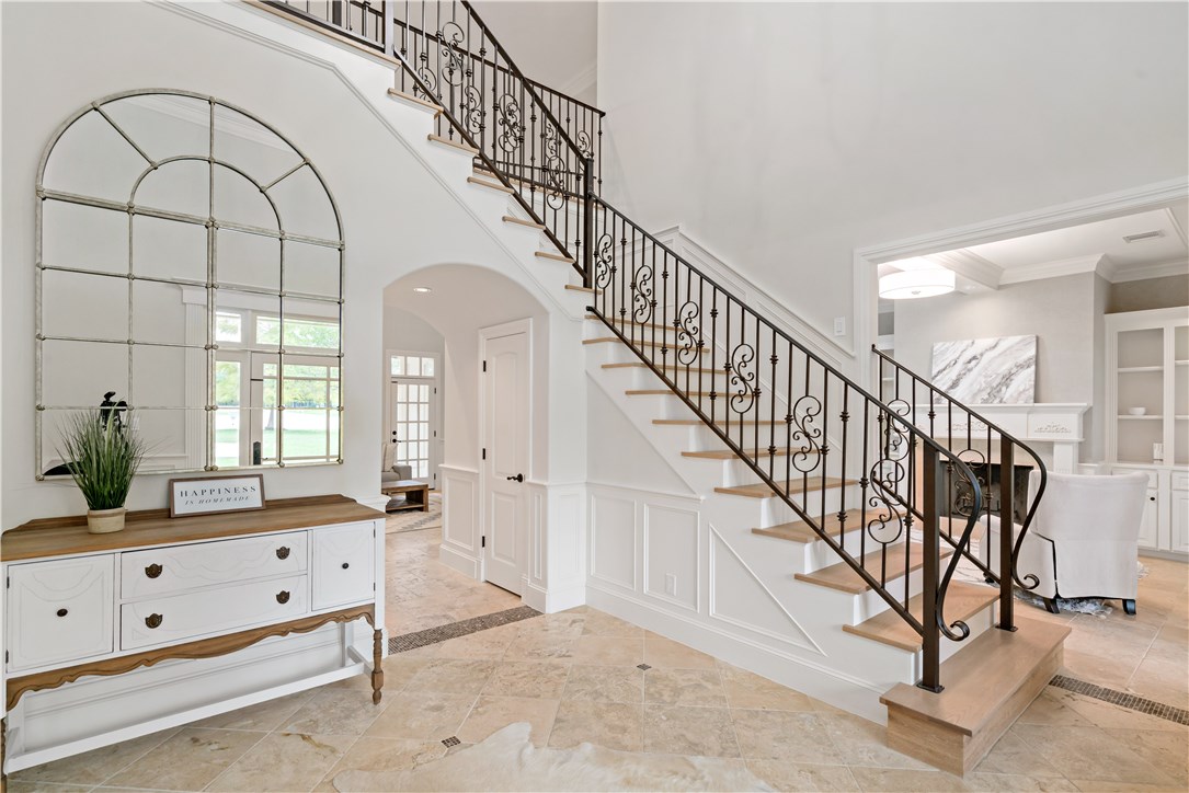 a view of staircase with white walls and windows