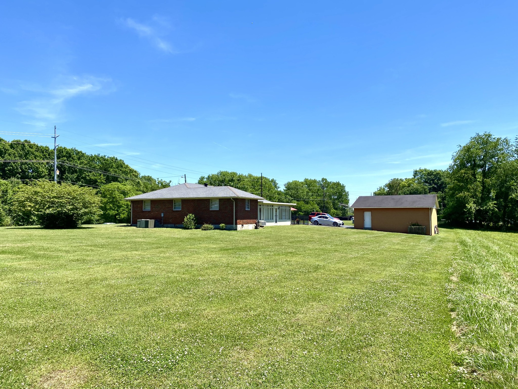 1102 Robinson Road Old Hickory, TN 37138 - Photo 15 of 36 a front view of a house with a yard and trees