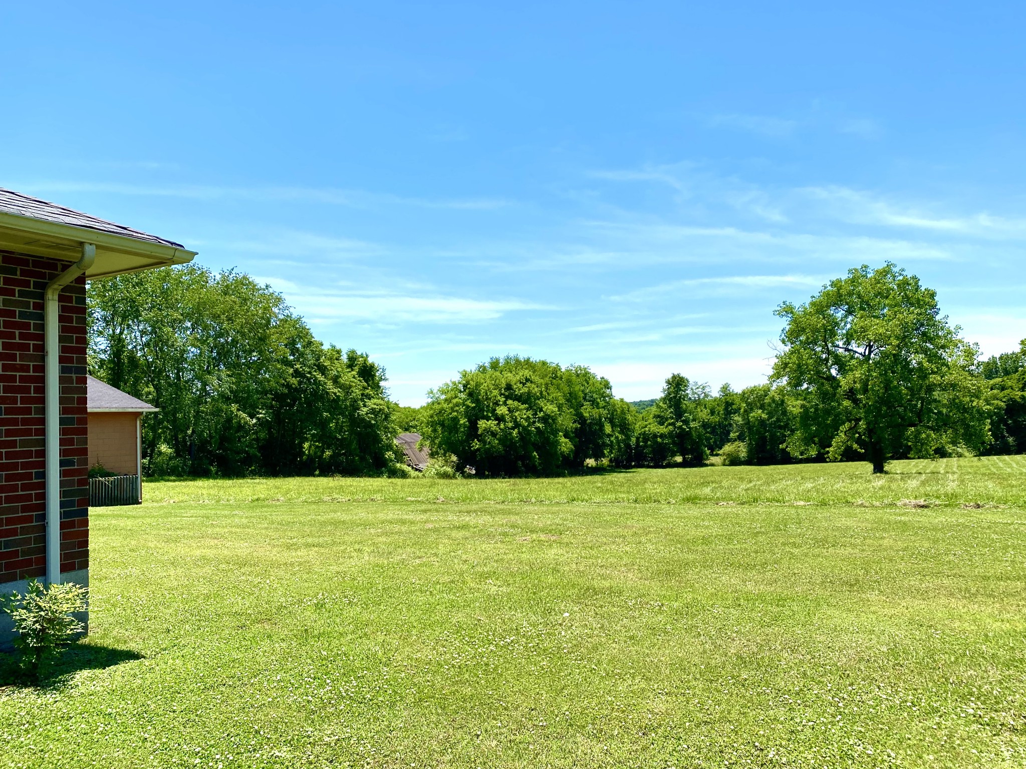 1102 Robinson Road Old Hickory, TN 37138 - Photo 4 of 36 a view of a green yard with a house