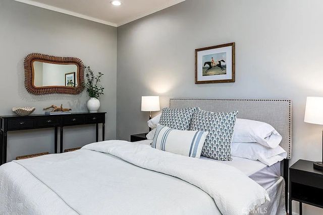 a bedroom with a bed and a table