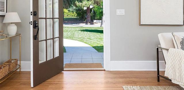 a view of kitchen with furniture and refrigerator