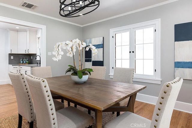a view of a dining room with furniture and window