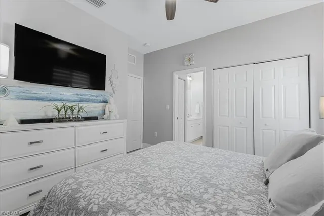 a living room with flat screen tv and a couch