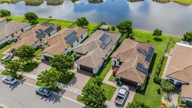 an aerial view of multiple houses with yard