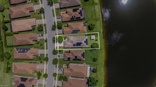 an aerial view of a house with a yard