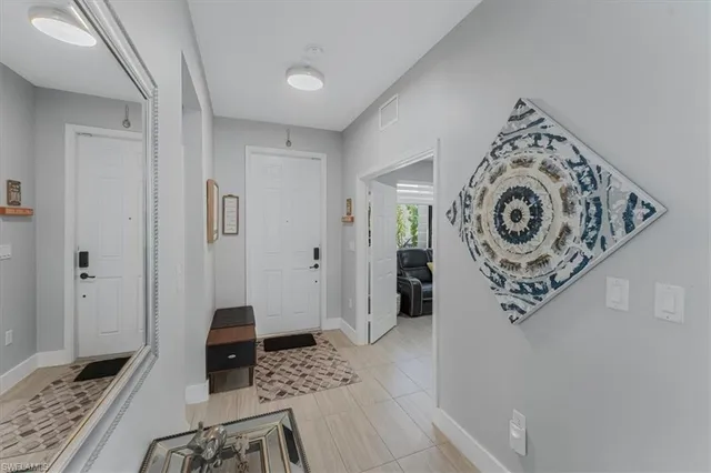 a view of a hallway with washer and dryer