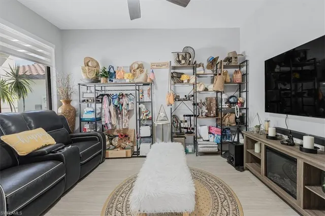 a living room with furniture and flat screen tv