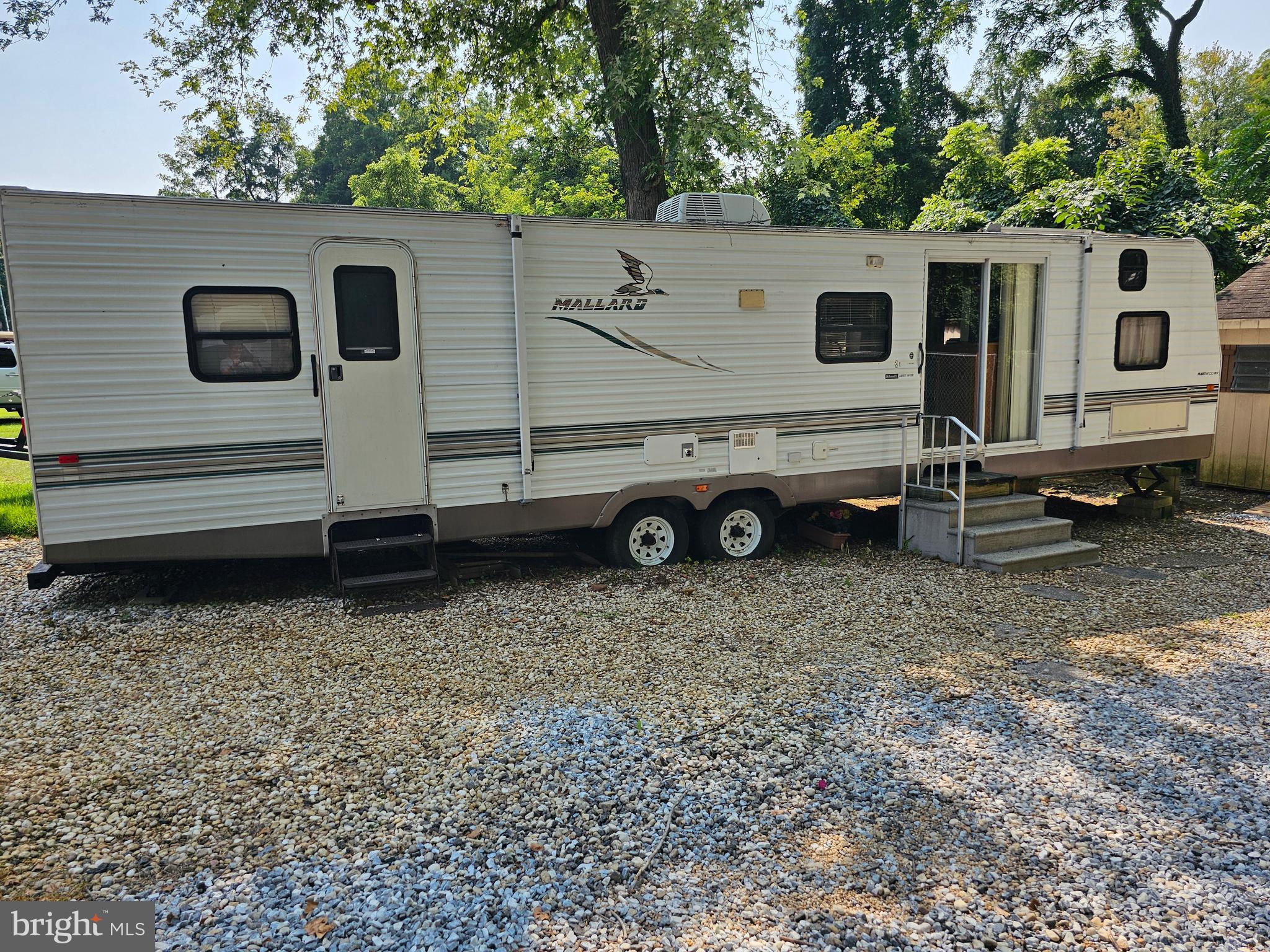 227-226 Little Beaver Lane, Unit GLEN 1 Earleville, MD 21919 - Photo 17 of 26 a view of a house with a backyard
