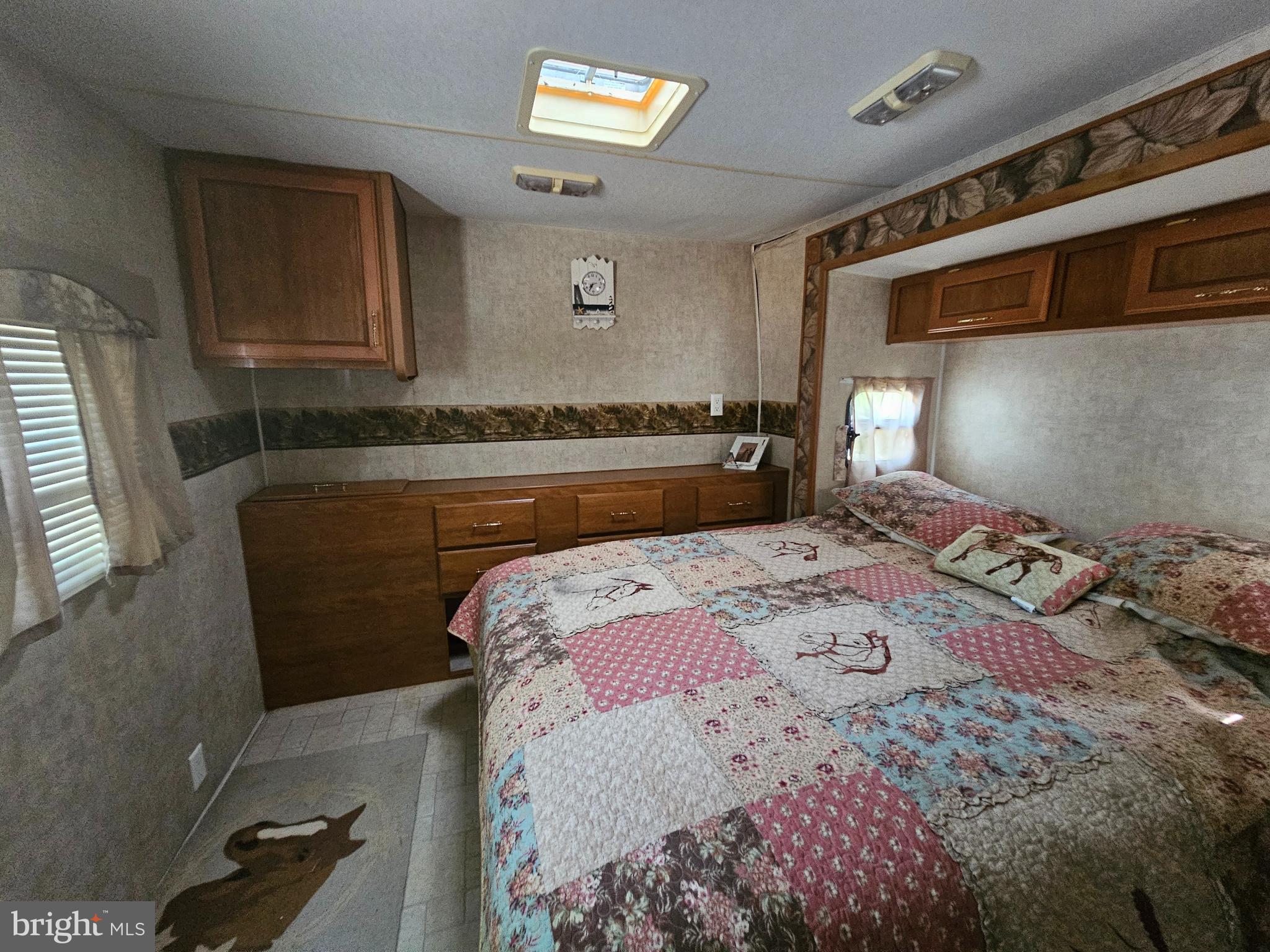 227-226 Little Beaver Lane, Unit GLEN 1 Earleville, MD 21919 - Photo 19 of 26 a bedroom with a bed and a dresser