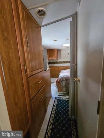a view of a kitchen with workspace and a window