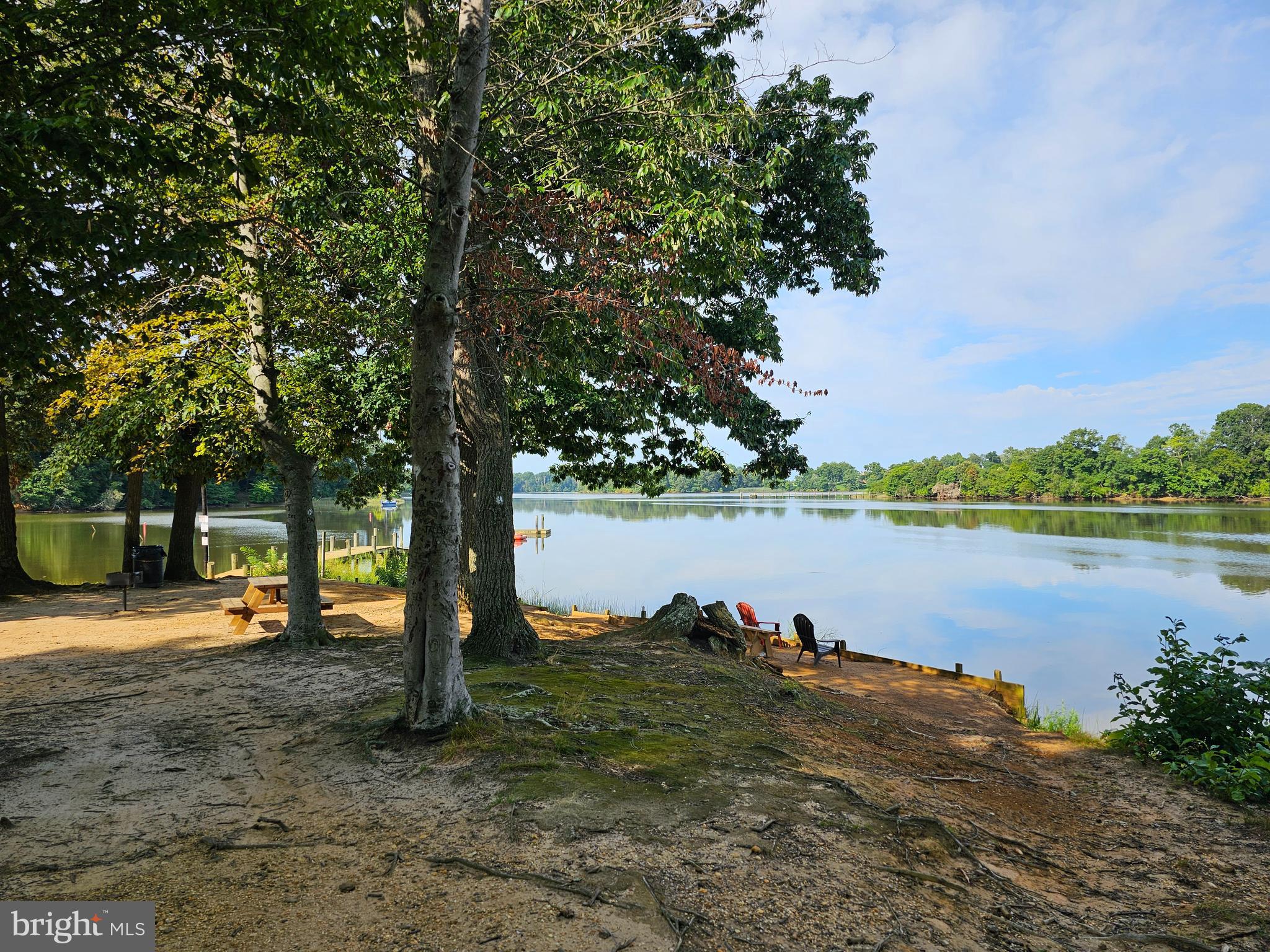 227-226 Little Beaver Lane, Unit GLEN 1 Earleville, MD 21919 - Photo 25 of 26 a backyard of a house with lots of green space and lake view