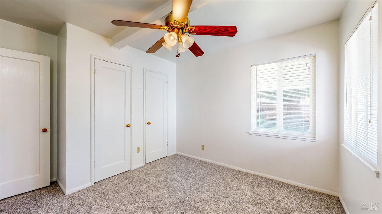 809 Maple Avenue Vallejo, CA 94591 - Photo 29 of 46 an empty room with ceiling fan and window