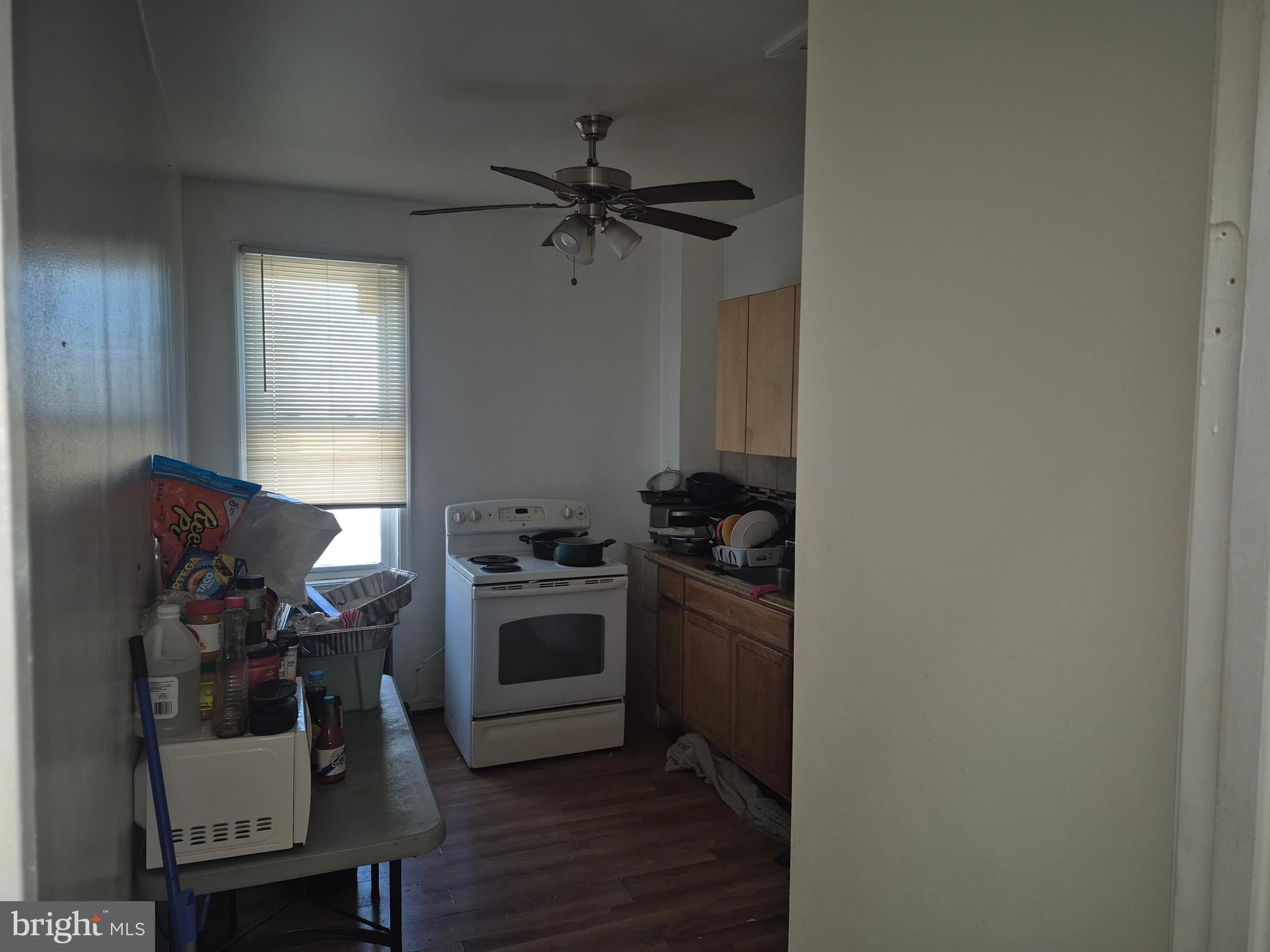 2924 Presstman Street Baltimore, MD 21216 - Photo 6 of 13 a view of a workspace with furniture and a window