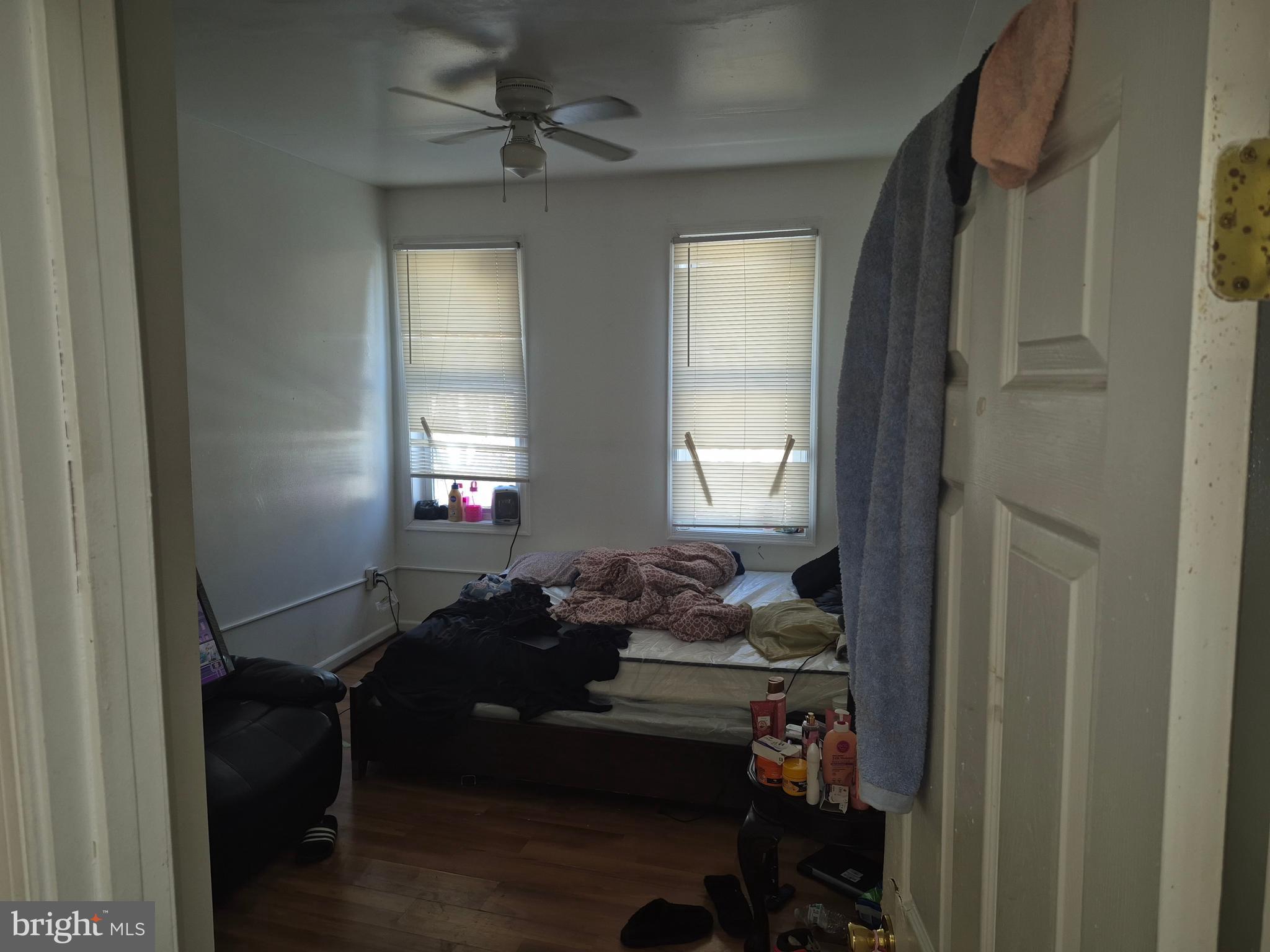 2924 Presstman Street Baltimore, MD 21216 - Photo 8 of 13 a living room with furniture and a window