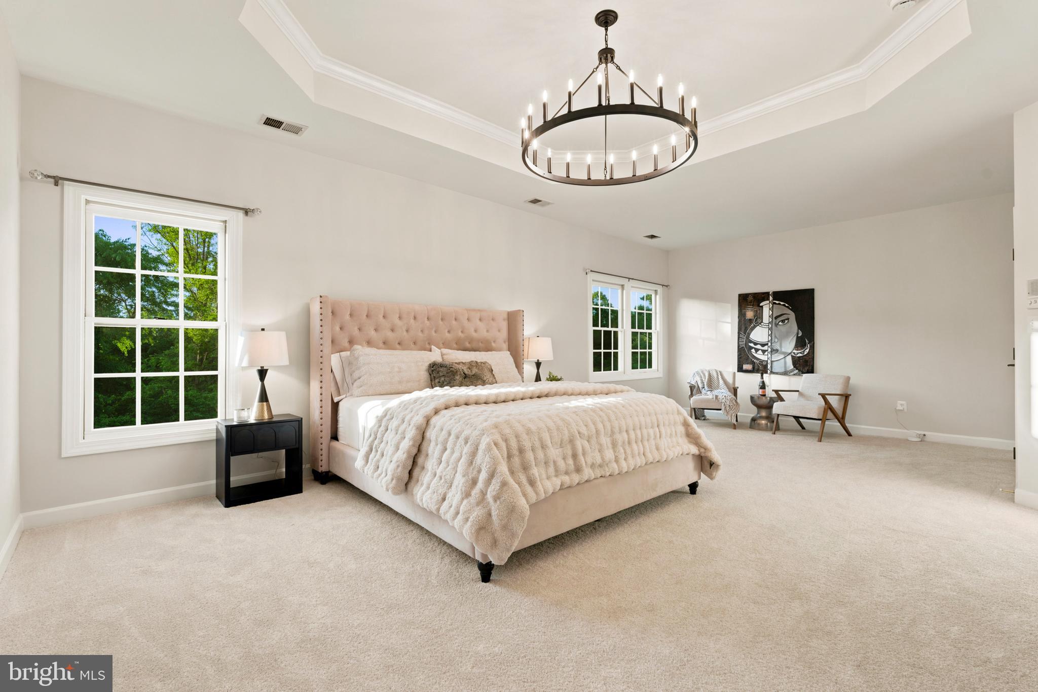 9313 Harrisons Farm Way Laytonsville, MD 20882 - Photo 33 of 77 a spacious bedroom with a bed and a large window