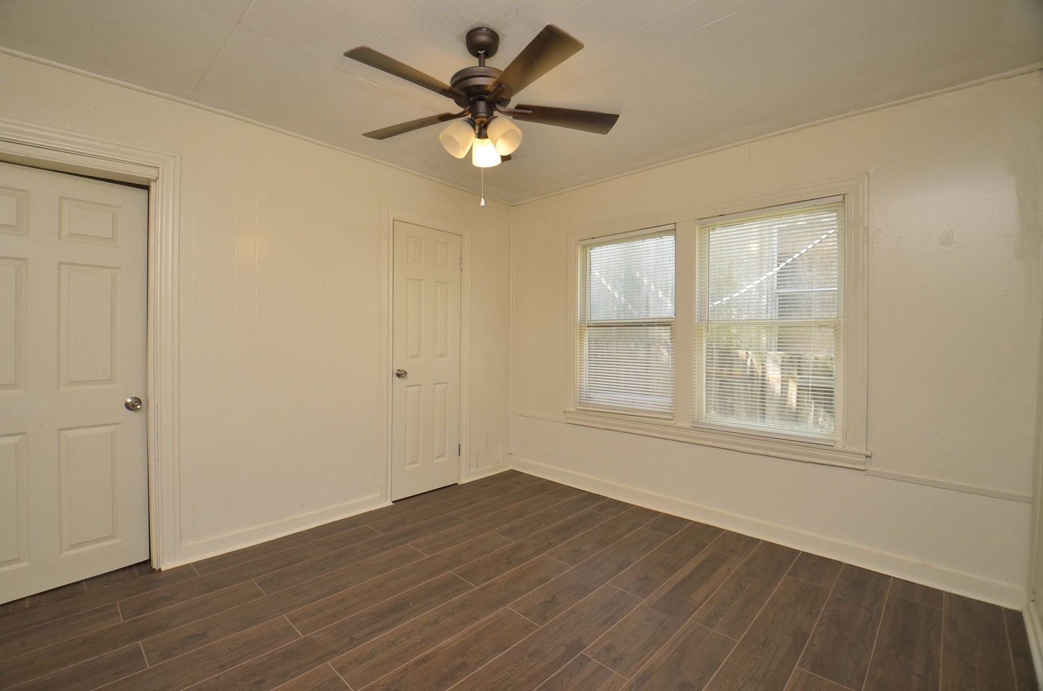 1600 5th Street Rosenberg, TX 77471 - Photo 17 of 24 Secondary bedroom with neutral finishes and natural light.