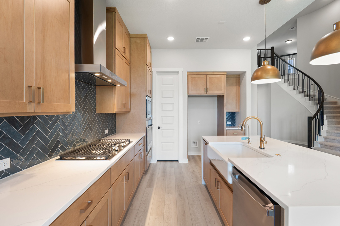 400 Bear Paw Run Georgetown, TX 78628 - Photo 12 of 38 a kitchen with a sink stove and cabinets