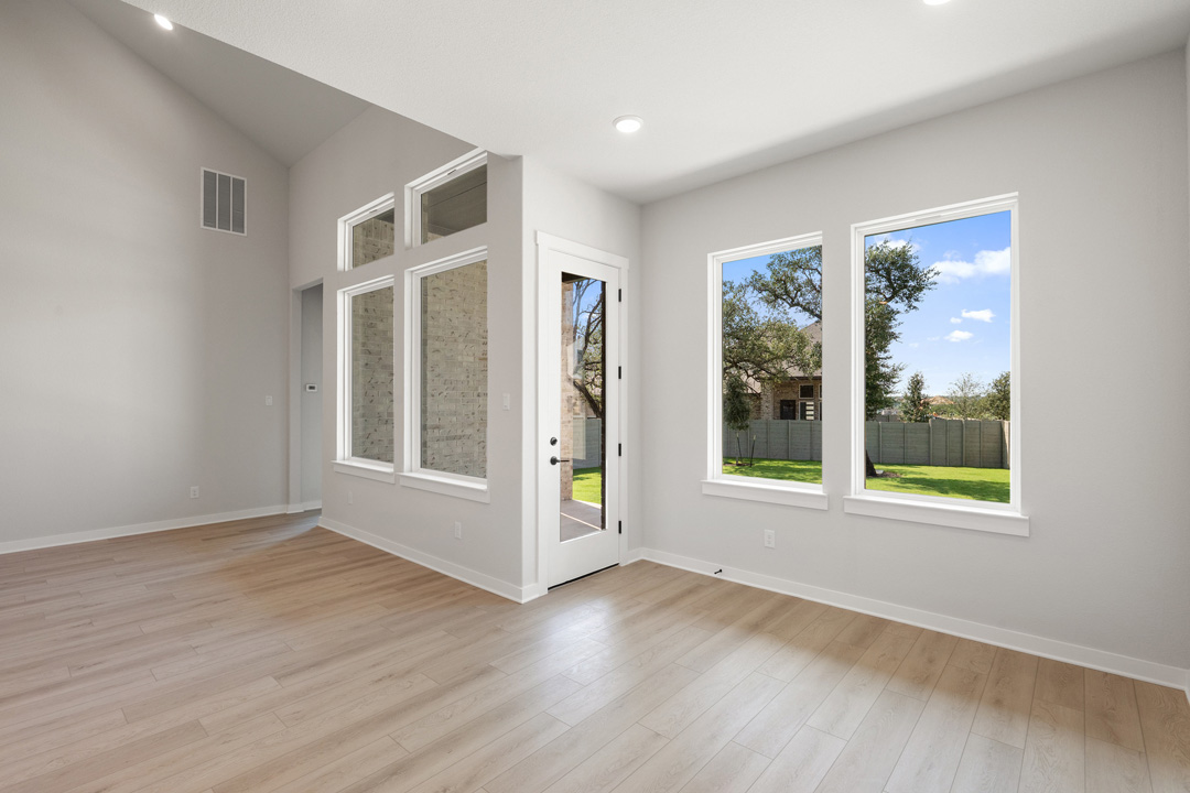 400 Bear Paw Run Georgetown, TX 78628 - Photo 14 of 38 a view of an empty room with wooden floor and a window