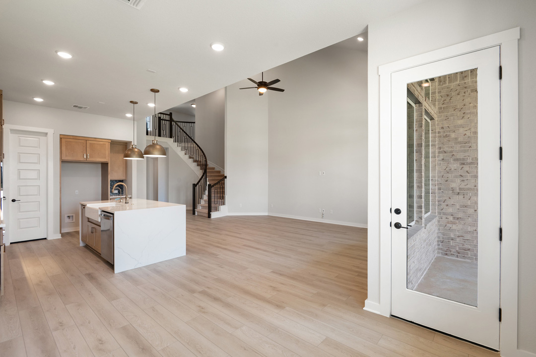 400 Bear Paw Run Georgetown, TX 78628 - Photo 15 of 38 a view of a hallway with wooden floor and staircase