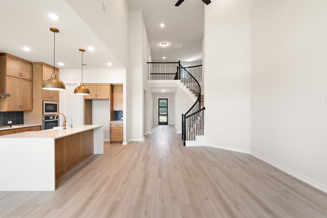 400 Bear Paw Run Georgetown, TX 78628 - Photo 16 of 38 a view of a kitchen with wooden floor and a kitchen