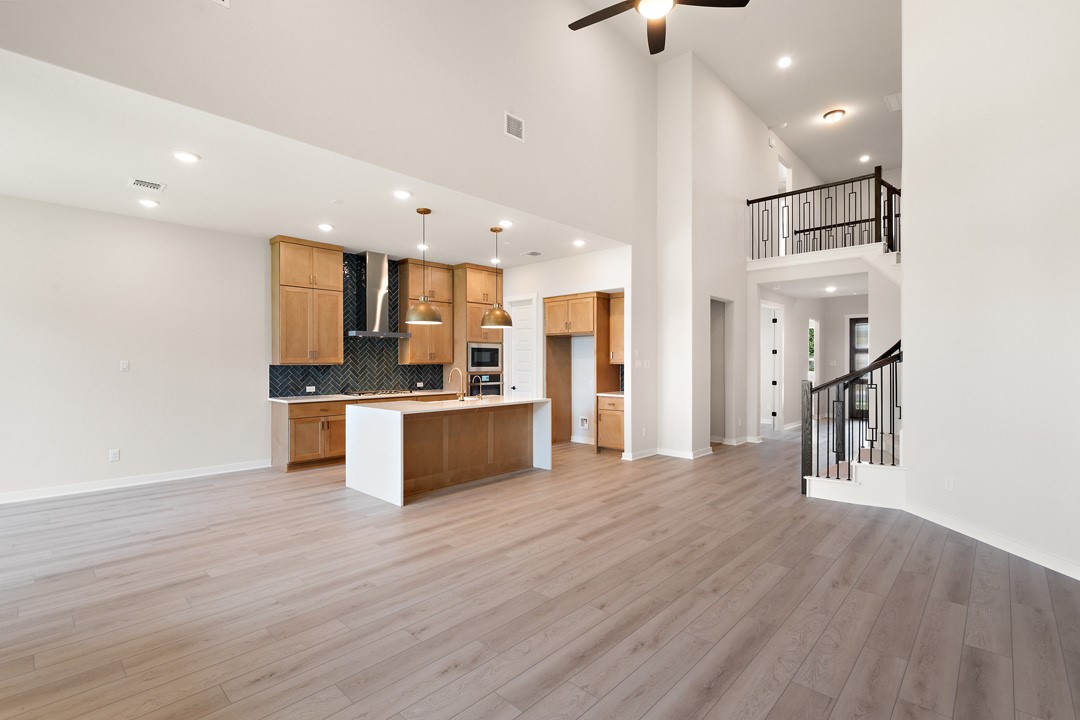 400 Bear Paw Run Georgetown, TX 78628 - Photo 17 of 38 a open kitchen with stainless steel appliances refrigerator sink and cabinets
