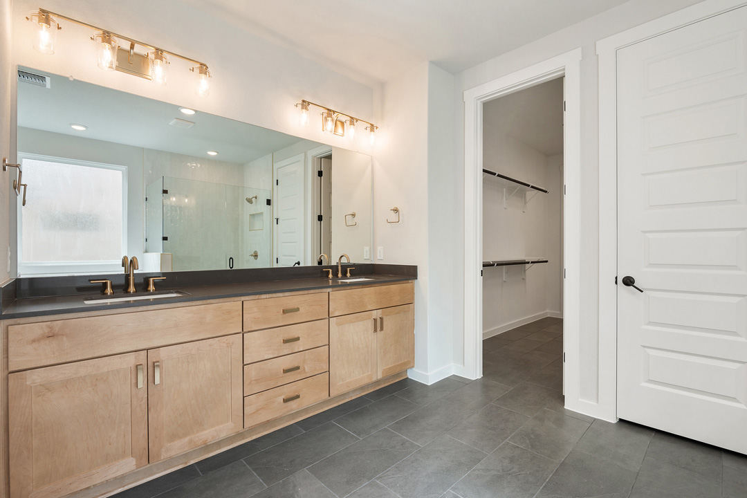 400 Bear Paw Run Georgetown, TX 78628 - Photo 23 of 38 a spacious bathroom with a granite countertop sink and a mirror