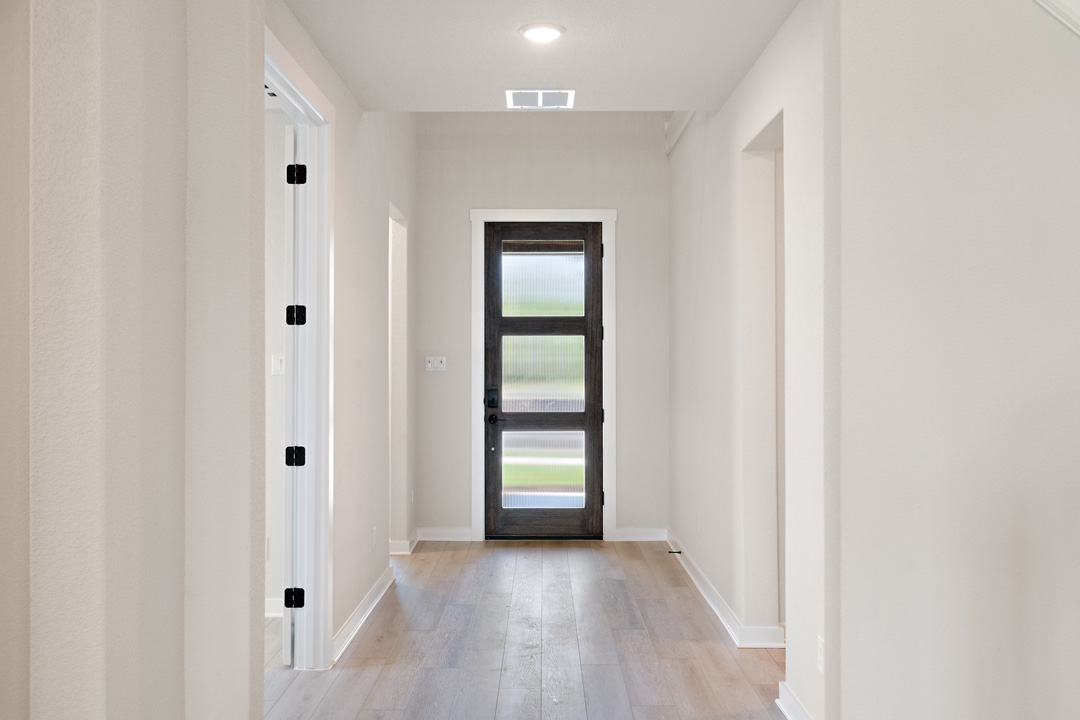 400 Bear Paw Run Georgetown, TX 78628 - Photo 4 of 38 a view of an entryway and wooden floor
