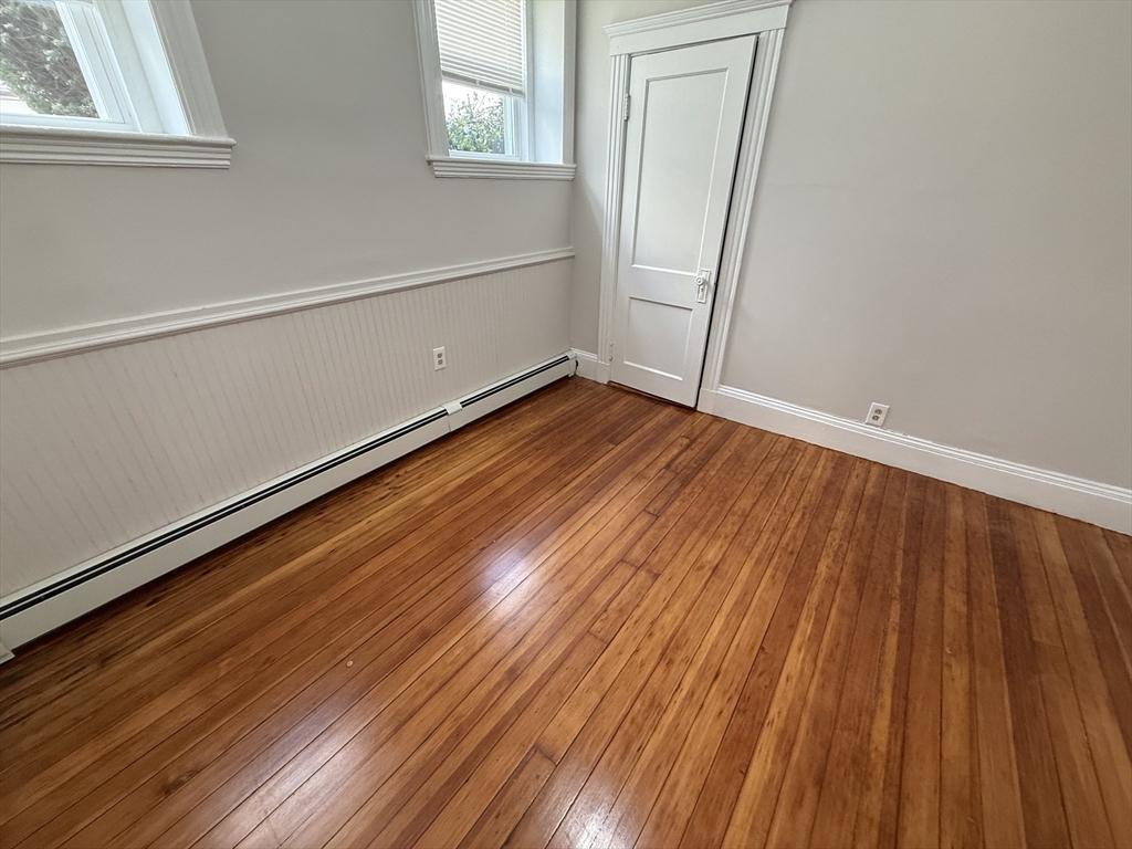 39 Newhall Street, Unit 20 Lynn, MA 01902 - Photo 5 of 11 a view of a room with wooden floor and windows