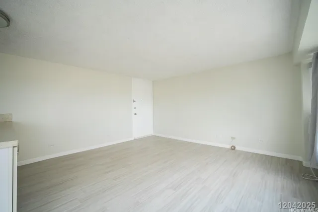 an empty room with wooden floor
