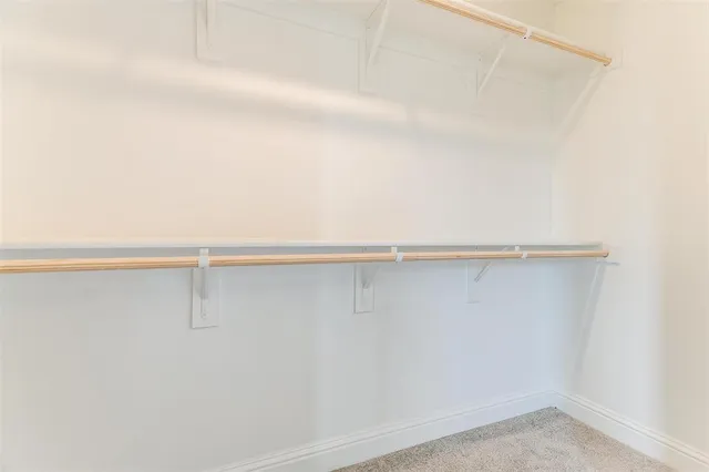a spacious bathroom with a double vanity sink mirror and shower