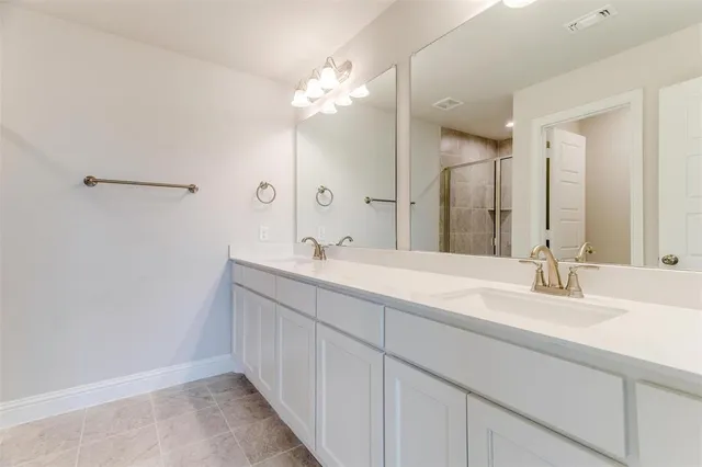 a bathroom with a shower toilet and sink