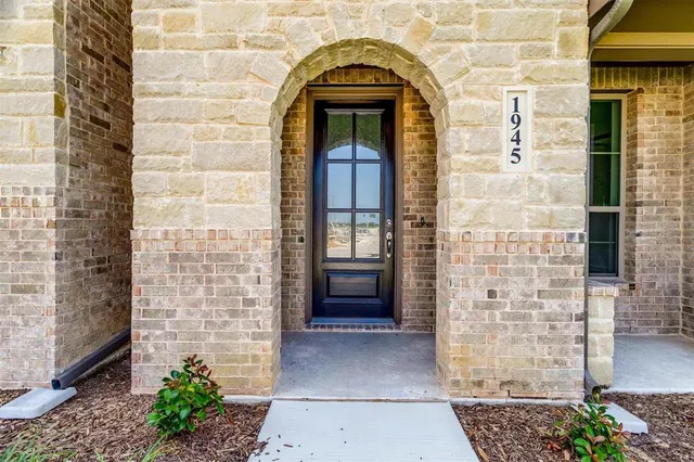 a view of front door of a house with a door