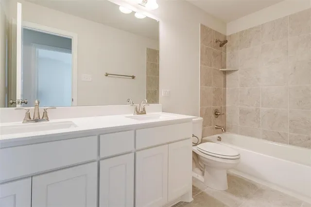 a bathroom with a sink a toilet and a bathtub