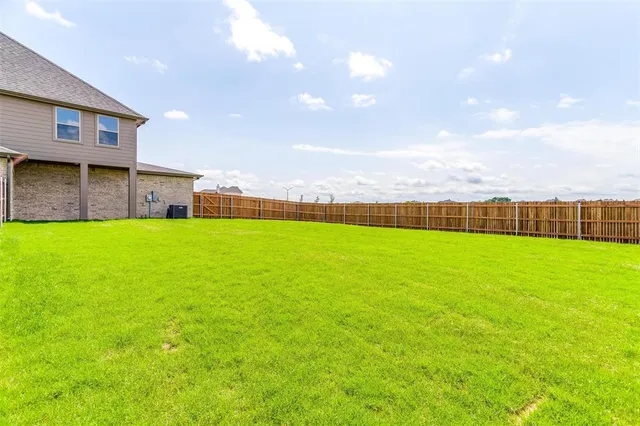 a view of a golf course with a lake