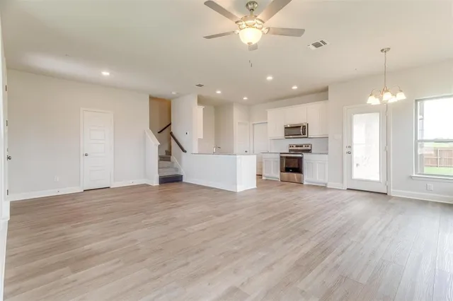 a view of a kitchen with a sink and a window